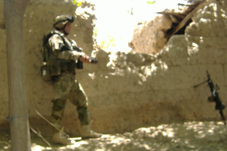 Royal Marine Lee Spencer, pictured on operations in Afghanistan, hits back at Trump 'insult'.