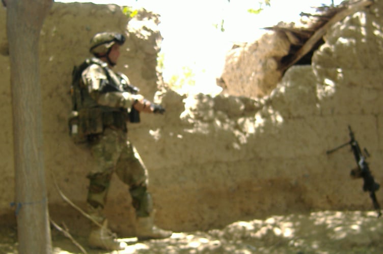 Royal Marine Lee Spencer, pictured on operations in Afghanistan, hits back at Trump 'insult'.