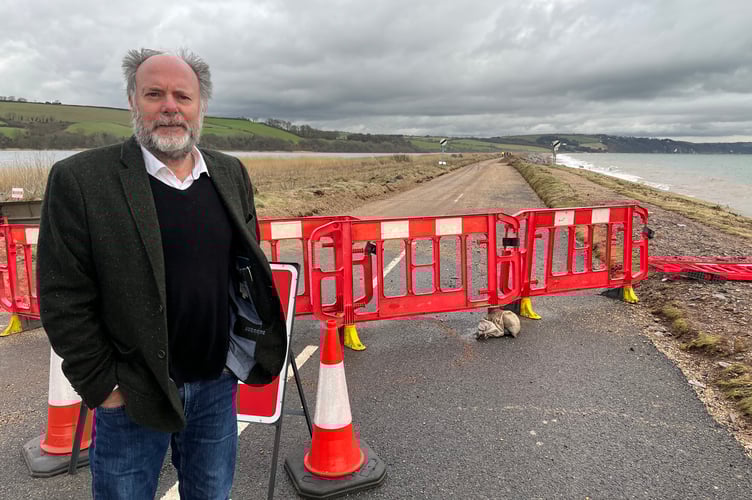 Councillor Julian Brazil, the leader of Devon County Council, assesses the damage to Torcross and the A379 road.