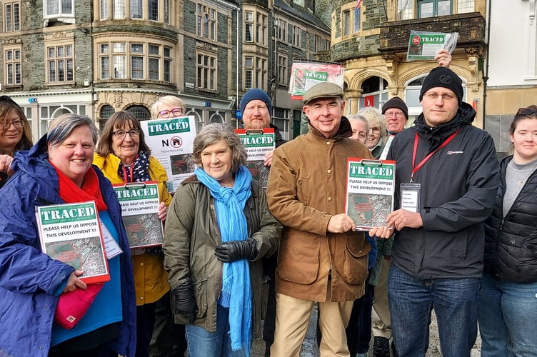 Campaigners against a plan to build a housing estate on Callington Road took their message to the public in Tavistock town centre. They are pictured with Torridge and Tavistock MP Sir Geoffrey Cox and Devon County Cllr Debo Sellis. Picture by James Bird.