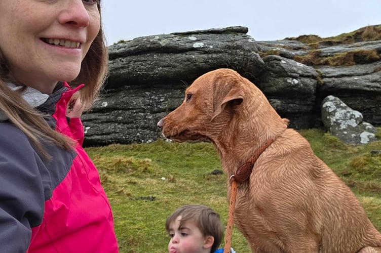 Stephie Harris, her son Noah and their pet dog on Dartmoor, near Princetown, on one of their sponsored walks in aid of women in danger.