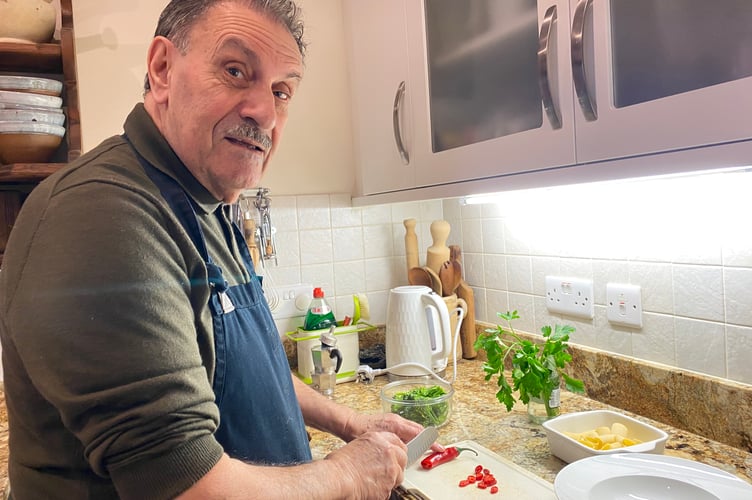 Giovanni Sponziello preparing an Italian pasta dish in Tavistock to eat watching Italy's Winter Olympics.