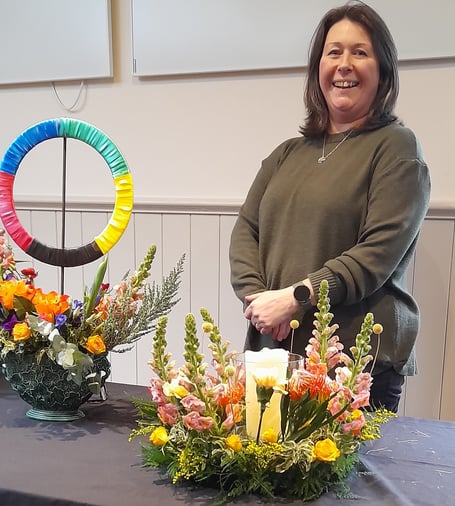 Helen Squires of Okehampton florist Heart of Flowers created arrangements inspired by the Winter Olympics at a recent meeting of Sampford Courtenay Flower Club.