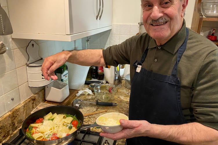 Talented Tavistock cook Giovanni Sponziello garnishes his patriotic tricolore pasta dish to mark the Cortina Winter OIympics, Cortina.
