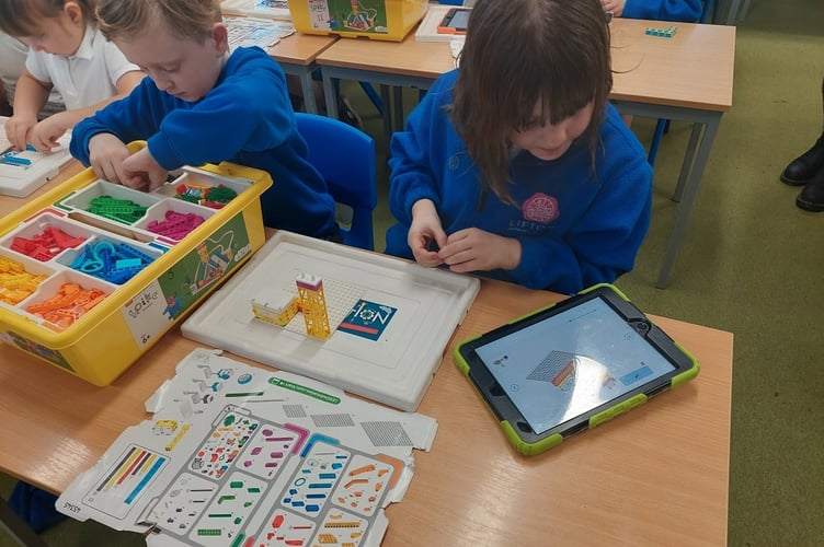 A budding Lifton Academy engineer designing and building a mini-robot.