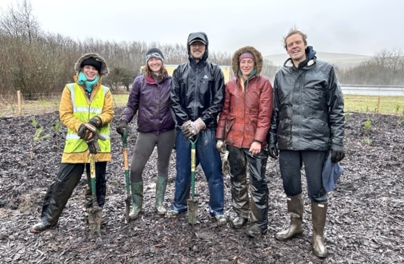 National Highways Estates Sustainability Manager Rebecca Brooks and Senior Environmental Adviser Ben Hewlett flanked by, left, Hannah Marshall, Director of Partnership Development at Earthwatch, Grace Gale, Earthwatch Project Manager, and CEO Harry Barton at the planting day, and, below, working with the A30 in view and the finished plot.