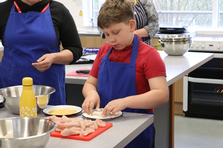 Breading a chicken goujon