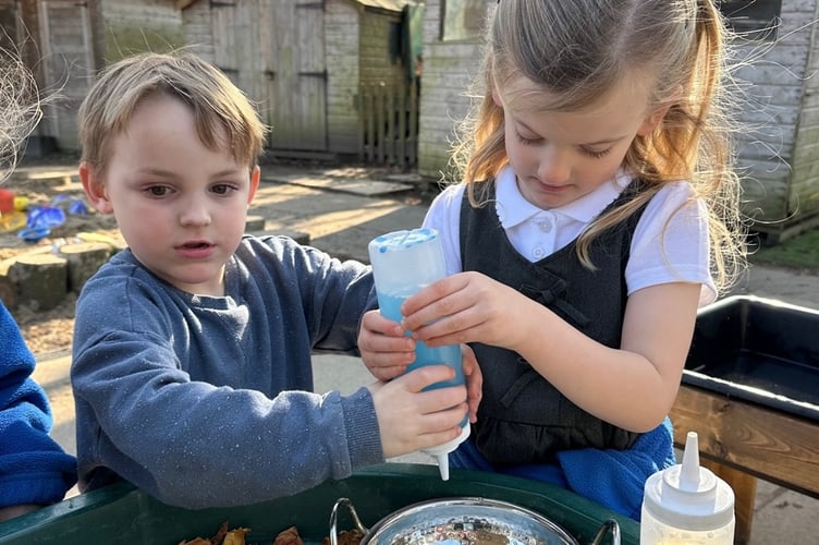 Lifton pupils learning together in their outdoor classroom.