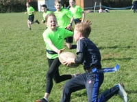 Hard tackling at primary school rugby contest