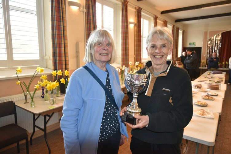 Zeal Hall chair Erica Eden, left, presented the Flower trophy to Sally Rauden.

