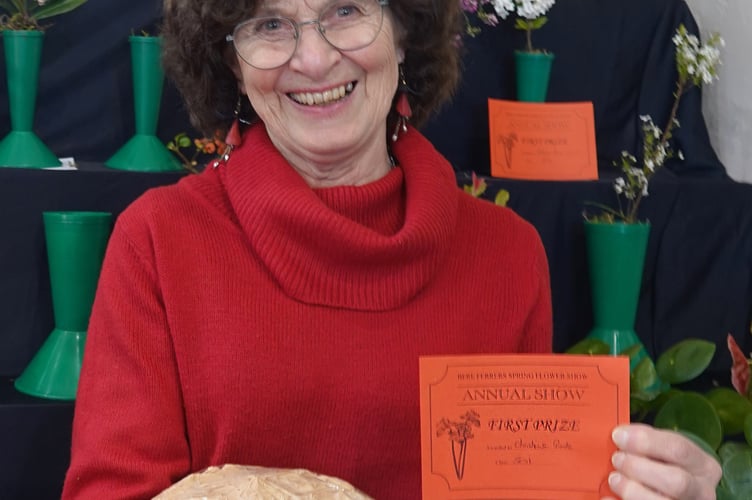 Bere Ferrers Flower Show exhibitor Christine Poole with her prize-winning coffee sponge. Picture by Ann Parsons.