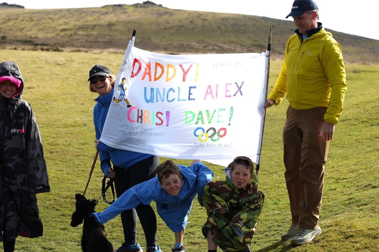 Some morale-boosting encouragement for a family team running the testing Dartmoor Marathon which returned on Sunday, April 12, after a 40-year absence. Picture by Chris Cottrell.