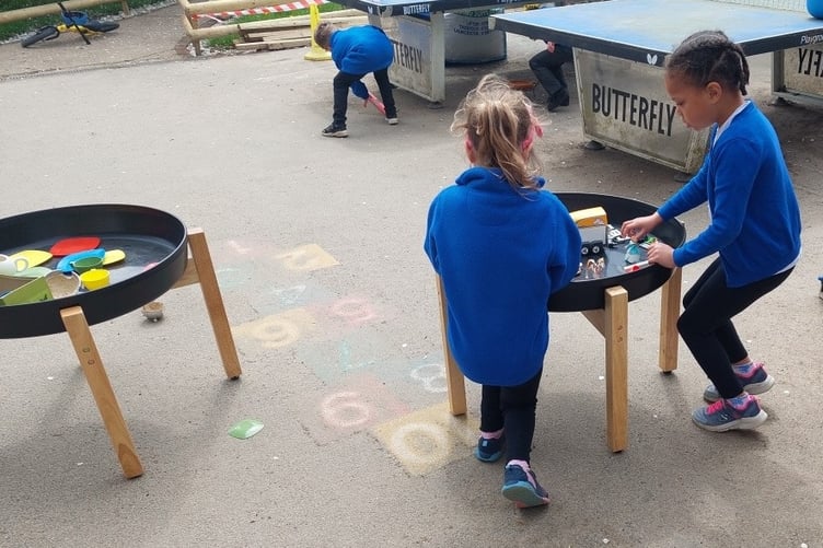Lifton Community Academy pupils enjoying their play tables which were bought using funds donated by Tesco.