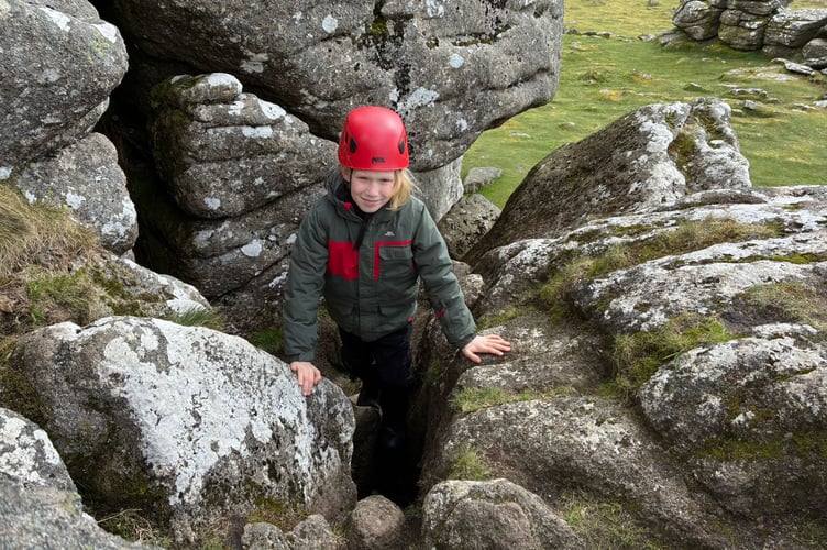 St Andrews School, Buckland Monachorum, pupils navigate the rocks on their Dartmoor residential adventure.