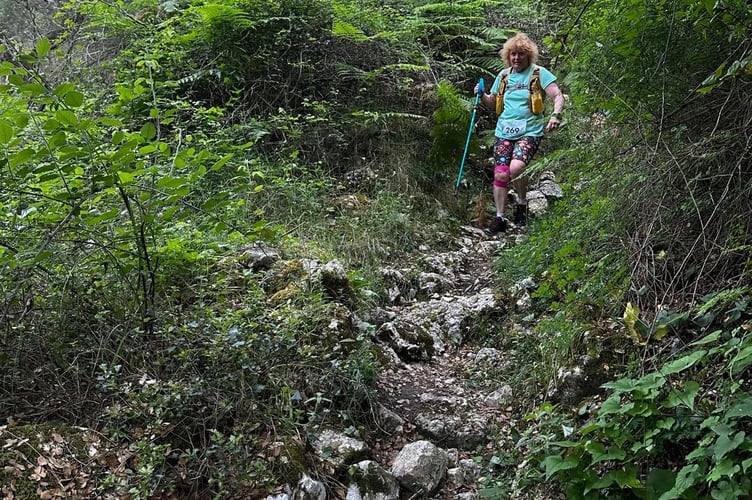 Dotty King watches her feet down a steep rocky mountainside during the Corfu 15-mile night mountain running race.