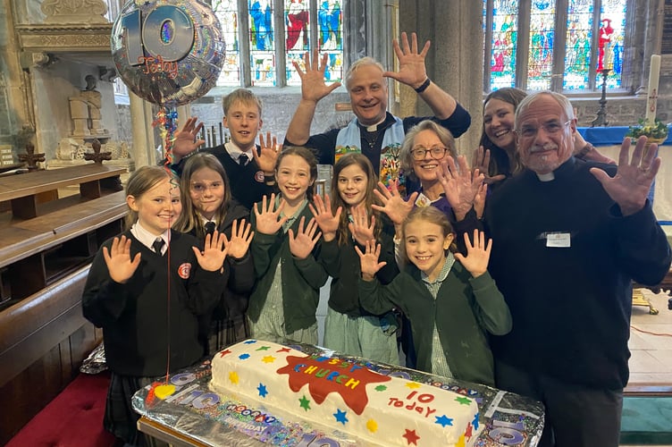 Tavistock Parish Church youngsters celebrated ten years of Messy Church play and worship with a cake and party crafts.