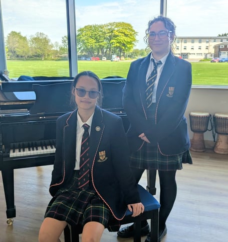 Grade 8 Distinction for Dolly and Cherrie