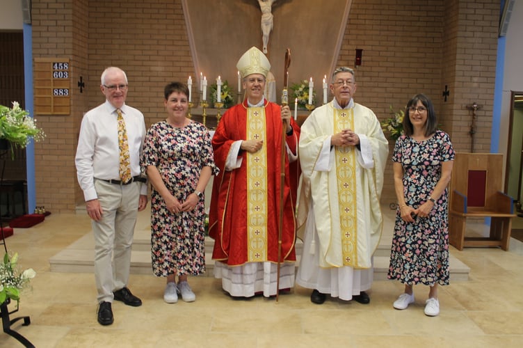 Bishop Nicholas Hudson, centre with, left, Dan Fitzgerald and Caroline Parkes and right, Father Michael Wheaton and Nicola Nathan.  AQ 1514
