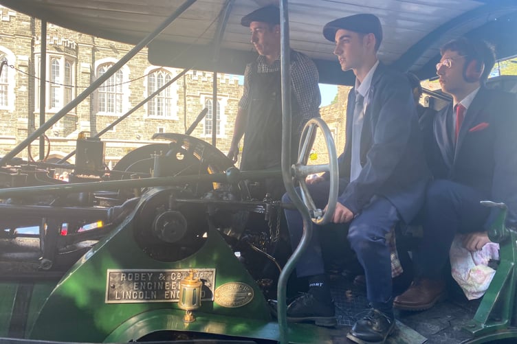 Steaming ahead are students Leon Spry, Dylan Lacey and Raith Glover arriving by Robey Trust steam engine. The three joined hundreds of families and classmates in Tavistock's Bedford Square for Tavistock College pre-proms gathering.