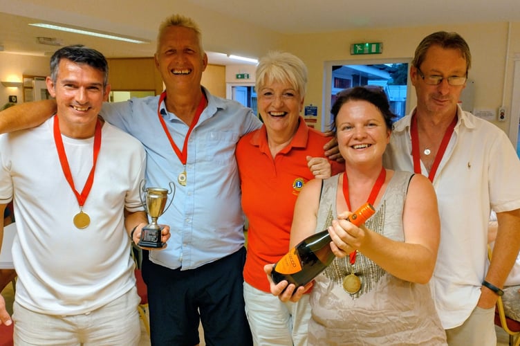Winners of the Traders' Skittles Competition with Lion Angela Hill.