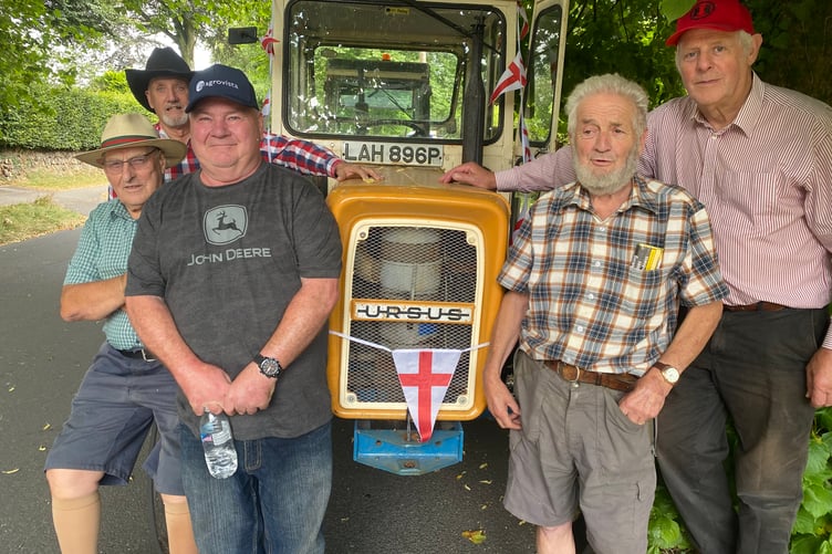A vintage tractor chugged along with Tavistock Lions Carnival Parade supported by a mini-procession of other tractors, pictured with their drivers.