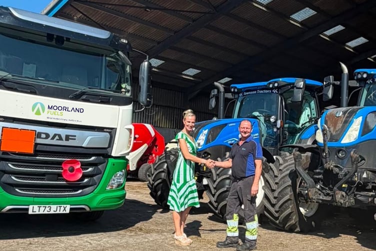 Georgina Lamb, head of partnerships at FCN with a Moorland Fuel representative.