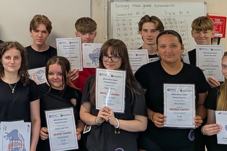 High achieving Tavistock College year ten triumphant with their national Junior Science Challenges certificates.