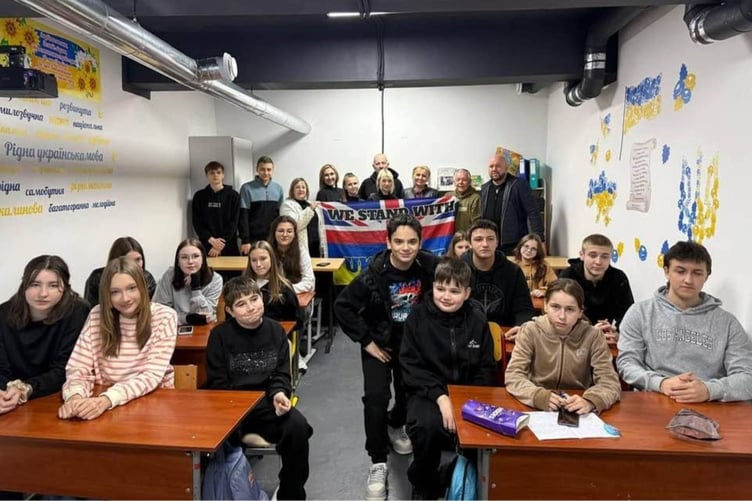 An underground bunker is these students' temporary classroom