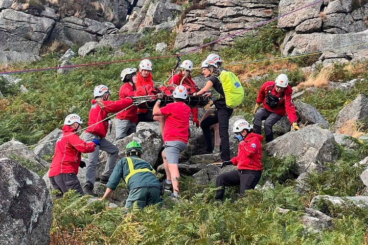 Dartmoor Search & Rescue Team Tavistock work with ambulance service paramedics on the difficult operation to rescue a boy who was hurt falling on Dartmoor.