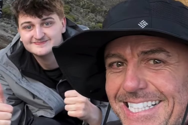 Tommy Warkcup and a climbing team mate on the volcanic slopes of their sponsored Mt Kilimanjaro climb in aid of the Down's Syndrome Association charity.