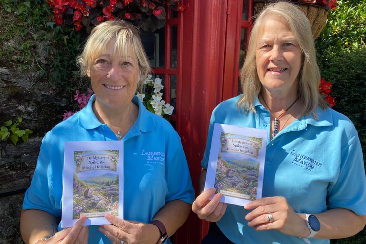 Jacqui Walton and Jane Cornbill, park assistant at Langstone Manor Holiday Park, near Tavistock, celebrate the publication of a charity children's book based on the site.
