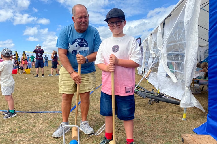 Freddie Roberts, 9, and grandad Paul Roberts learn the arts of croquet at Yelverton Rotary Club Family Fun Day.