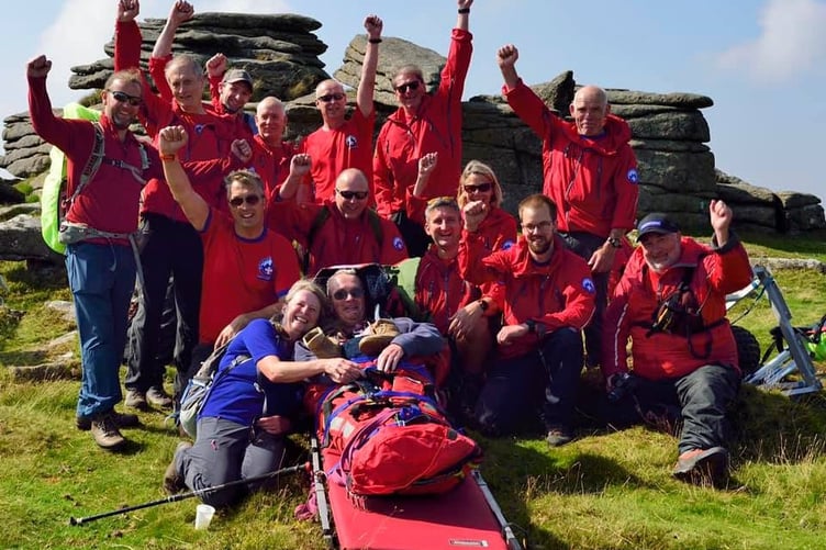 Gilby Taylor (front, second from left) with his wife Jane and the NDSART team at the top of Belstone Tor in 2021.