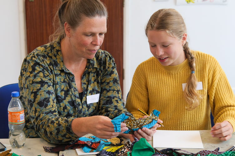 A pair learn how to design textile prints at a Tavistock Respect Festival workshop. Picture by Greg Symon.