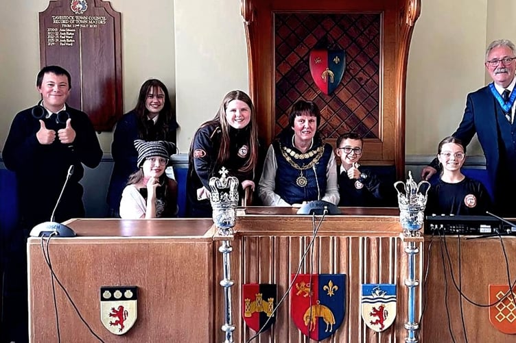 Youngsters from Tavistock Youth Cafe are welcomed by the mayor and deputy mayor in Tavistock Council Chamber.