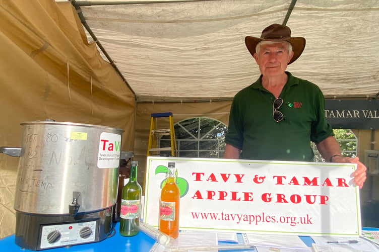 Peter Wright, of Tavy and Tamar Apple Group sells freshly pressed apple juice at Bere Apple Fest.