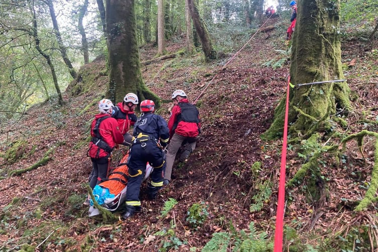Volunteer mountain rescuers use rope skills to rescue an injured fallen walker at Lydford Gorge.