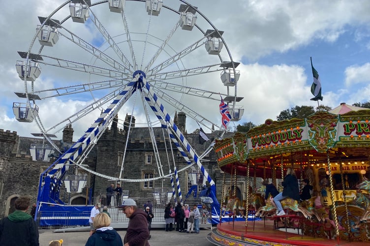 Tavistock Goose Fair funfair big wheel and roundabout bringing joy to youngsters.