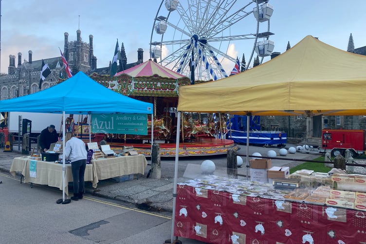 Stallholders set up today in front of Tavistock Town Hall and the fun fair big wheel ready for the expected crowds at Tavistock Goose Fair today.