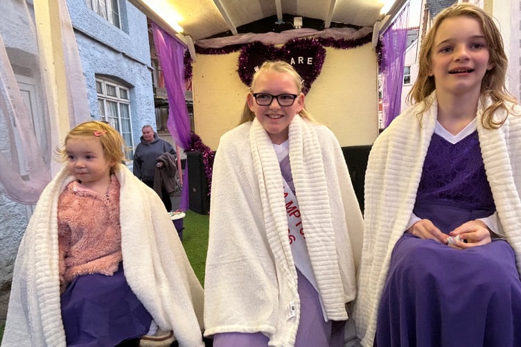 Carnival Queen Lilly Hendry, centre, on her float with princesses - and her cousins - Amelia, left, and Layla-Grace Chastey. Okehampton Carnival 2026.