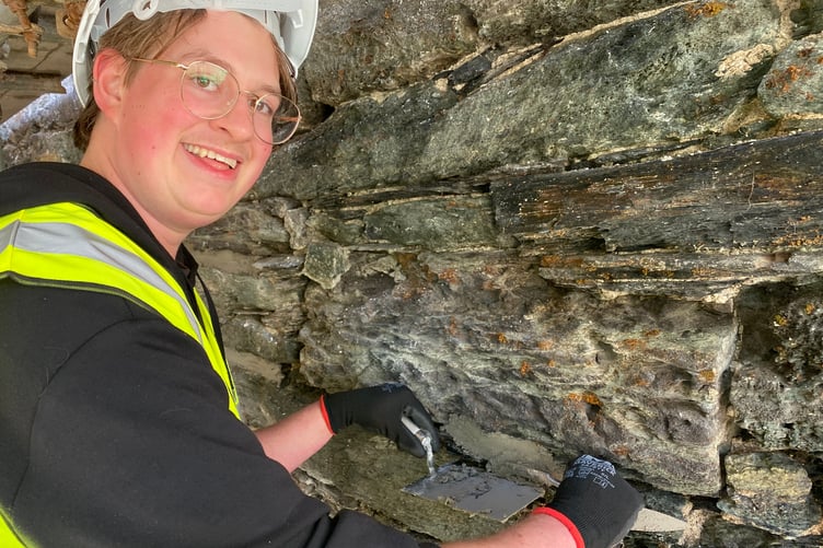 A member of the public has a go at restoring Tavistock's historic Betsy Grimbal's Tower.