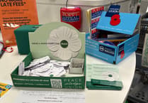 White peace poppies join red poppies in Tavistock library