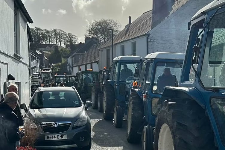 Fran Mudge's charity tractors run attracts residents through Buckland Monachorum. Picture by Ann Glanville.