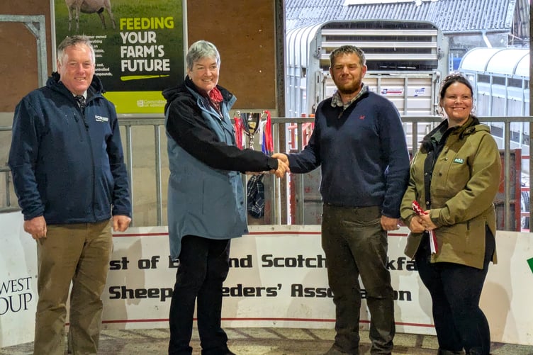 The Vanstone family receive the inaugural Mike Malseed Perpetual Cup at Tavistock Livestock Market.