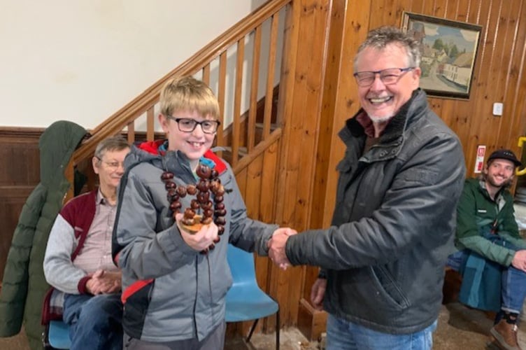 Junior champion Louie Evans with his Conker Man trophy